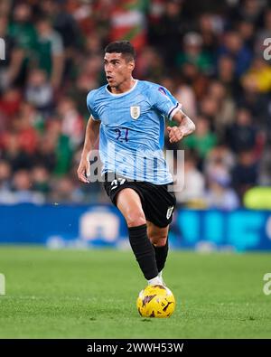 Bilbao, Spain. 23 March, 2024. Lucas Olaza of Uruguay with the ball during the Friendly Match Pais Vasco v Uruguay at Estadio de San Mames on March 23, 2024 in Bilbao, Spain. Credit: Cesar Ortiz Gonzalez/Alamy Live News Stock Photo