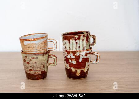 Four handmade ceramic glazed coffee cups. High quality photo Stock Photo