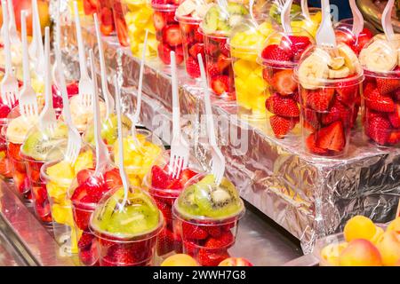 Plastic cups with fruit on a market in Valencia, Spain Stock Photo