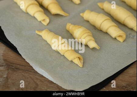 Before and after -homemade croissant baking at home. 1 Stock Photo