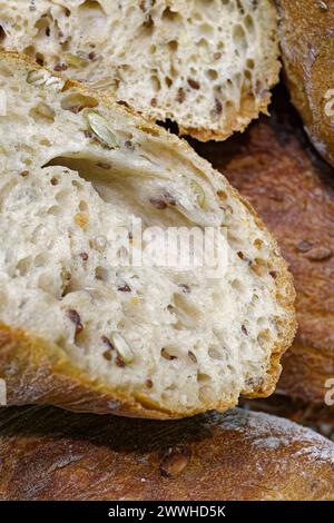 Freshly baked traditional multigrain bread, abstract food background Stock Photo