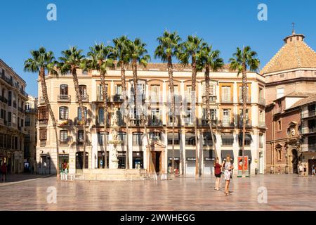 MALAGA, Spain, 01.09.2019. Constitution Square (Plaza de la Constitucion) in Malaga, iconic public square, with Spanish architecture and palm trees. Stock Photo