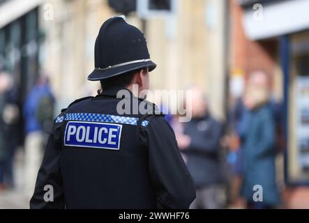 UK Police officer on duty in Hampshire,  pictured from behind. Stock Photo