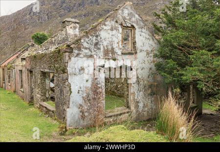 Derelict Irish house in the middle of nowhere reduced to just walls standing Stock Photo