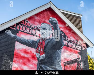 A mural of former Liverpool FC manager Bill Shankly pictured in front of the Shankly Gates pictured along Anfield Road in Liverpool, seen in March 202 Stock Photo