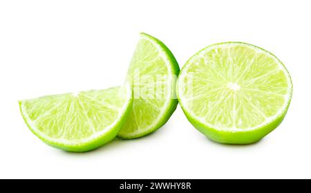 Front view of fresh green lemon half with slices or quarters is isolated on white background with clipping path. Stock Photo