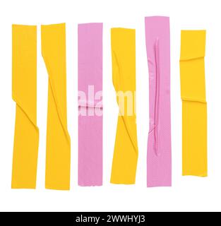 Top view set of wrinkled yellow and pink adhesive vinyl tape or cloth tapes in stripe shape is isolated on white background with clipping path. Stock Photo
