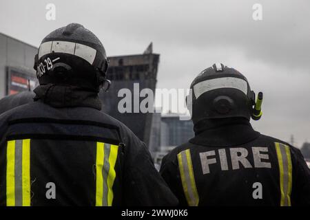 Moscow region, Russia. 24th of March, 2024. An emergency services workers are seen outside the Crocus City Hall in the town of Krasnogors, Moscow region, Russia. Credit: Nikolay Vinokurov/Alamy Live News Stock Photo