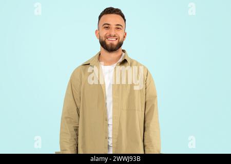 Studio shot of confident positive young man in casual Stock Photo