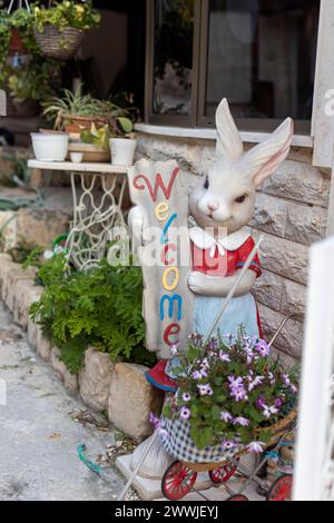 Ceramic hare with a sign - Welcome at the entrance to the house. Stock Photo