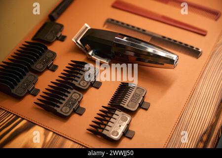 Electric hair clipper with clean razor blades on table Stock Photo
