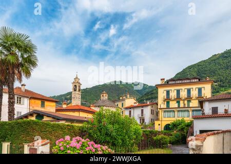 Lenno town on Como lake with colorful buildings and church, Lombardy, Italy. Popular travel and tourist destination on summer vacations Stock Photo