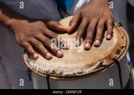 Percussionist hands playing atabaque. African music. Percussion instrument. Stock Photo