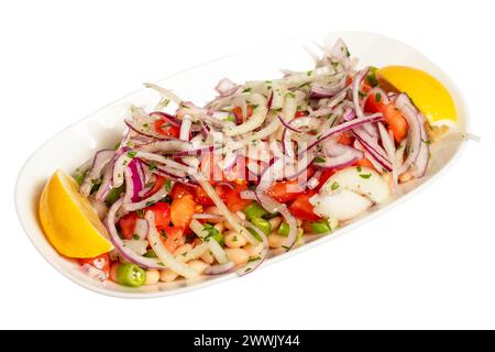 Bean salad. Belarus salad isolated on white background. This salad is made with beans, onion, parsley, chili peppers, sumac, lemon juice and olive oil Stock Photo
