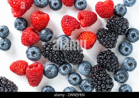 Mix of fresh berries: raspberry, blackberry, blueberry on a white background Stock Photo