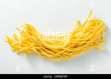 spaghetti. uncooked fresh Italian pasta on a white background Stock Photo