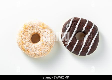 Sweet donuts with chocolate glaze and sugar on white Stock Photo