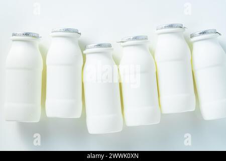drinking yogurt with probiotic in bottles on white Stock Photo