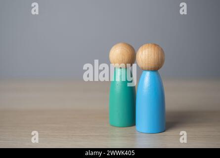 Friendly relations. Two human figures stand together. Cooperation and collaboration. A meeting. Communication and discussion. Make friends. A team Stock Photo