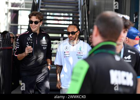 MELBOURNE, AUSTRALIA 24 March 2024. Pictured: George Russell and 44 Lewis Hamilton (GBR) Mercedes-AMG Petronas F1 Team return to the paddock following the Sunday drivers' parade at the FIA Formula 1 Rolex Australian Grand Prix 2024 3rd round from 22nd to 24th March at the Albert Park Street Circuit, Melbourne, Australia. Credit: Karl Phillipson/Alamy Live News Stock Photo