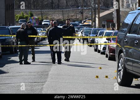 Shell casings discovered at the crime scene and marked by several ...