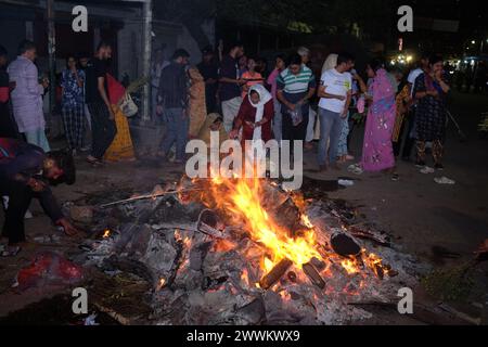 Prayagraj, India. 24th Mar, 2024. People from Hindu community fire the 'Holika' on Sunday night to celebrate Holi festival in district Prayagraj, Uttar Pradesh. Hiranyakashipu's sister, Holika, had a boon granting her immunity to fire. She attempted to trick Prahlad into a pyre, but divine intervention led to her demise while Prahlad emerged unscathed. This event symbolizes the victory of good over evil, a theme central to Holika Dahan. (Photo by Shashi Sharma/Pacific Press) Credit: Pacific Press Media Production Corp./Alamy Live News Stock Photo