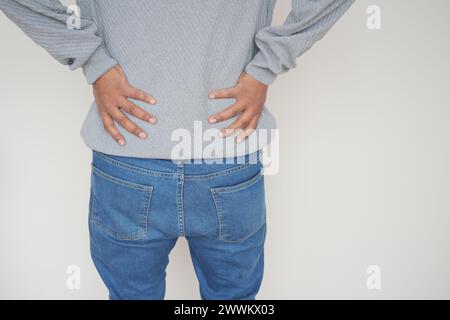 young man suffering back pain close up Stock Photo
