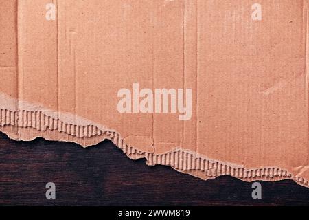 Torn cardboard paper texture, light brown craft paper material pattern as background, top view Stock Photo
