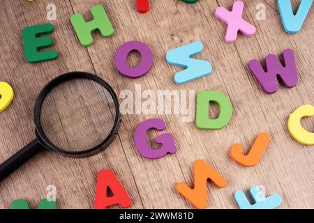 Alphabet with a magnifying glasses Stock Photo