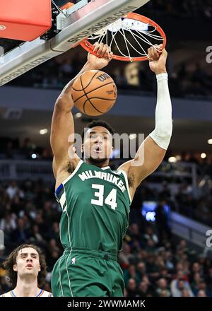 Milwaukee, USA. 24th Mar, 2024. Milwaukee Bucks' Giannis Antetokounmpo dunks during NBA regular season game between Oklahoma City Thunder and Milwaukee Bucks in Milwaukee, the United States, on March 24, 2024. Credit: Joel Lerner/Xinhua/Alamy Live News Stock Photo