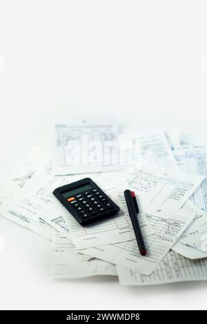 Calculating numbers for bill with pen and calculator Stock Photo
