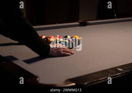 Close up of man racking pool balls Stock Photo