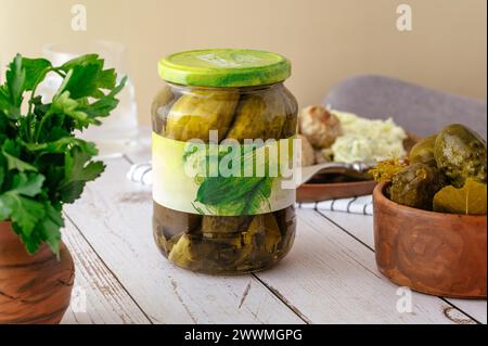 pickled cucumbers in a jar on the table Stock Photo