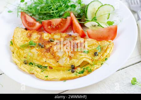Healthy breakfast.Quesadilla with omelette, bacon  and tomatoes salad. Keto, ketogenic lunch. Stock Photo