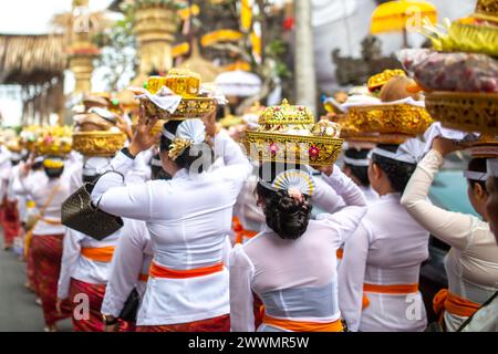 A group of unrecognizable women during a traditional ceremony in front of a temple Stock Photo