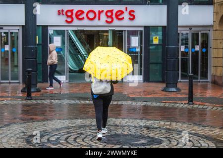 St Geroge's Preston, Lancashire.  UK Weather. 25 March 2024.  We shall have rain.  Heavy rain and a moderate breeze as yet more rain falls in the north-west of England Credit MediaWorldImages/AlamyLiveNews Stock Photo