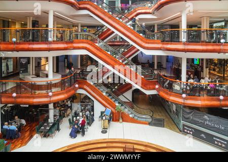 Interior of Princes Square shopping mall showing the food hall on the ground floor and the escalators to the shopping zones, Glasgow, Scotland, UK Stock Photo