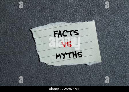 Facts vs myths words written on torn paper piece with gray background. Conceptual symbol. Copy space. Stock Photo