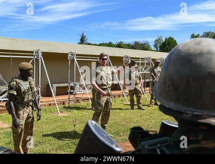British army Capt. Hugo Brewer, an army officer assigned to 1st Battalion Irish Guards, 11th Security Forces Assistance Brigade, briefs the Tanzania service members during a counter improvised explosive devices training at Justified Accord 2024 (JA24), held at the Counter Insurgency Terrorism and Stability Training Centre, Nanyuki, Kenya, February 26, 2024. JA24 is U.S. Africa Command's largest exercise in East Africa, running from February 26 - March 7. Led by U.S. Army Southern European Task Force, Africa (SETAF-AF), and hosted in Kenya, this year's exercise will incorporate personnel and un Stock Photo
