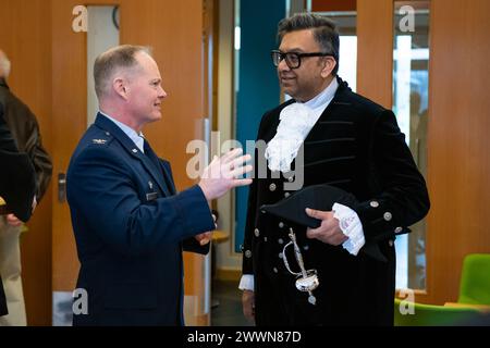 U.S. Air Force Col. D. Landon Phillips, left, 501st Combat Support Wing commander, speaks with Milan Shah, right, High Sheriff of Northamptonshire before a Ceremony of Remembrance at Stanwick Lakes, England, Feb. 22, 2024. U.S. and U.K. leaders gathered to honor 17 Airmen who died in a midair collision on Feb. 22, 1944, involving B-17 Flying Fortresses from the 303rd Bombardment Group at RAF Molesworth and the 384th Bombardment Group at RAF Grafton Underwood. The Airmen were part of Operation Argument, or 'The Big Week,' targeting enemy industrial sites and aircraft facilities in Central Europ Stock Photo