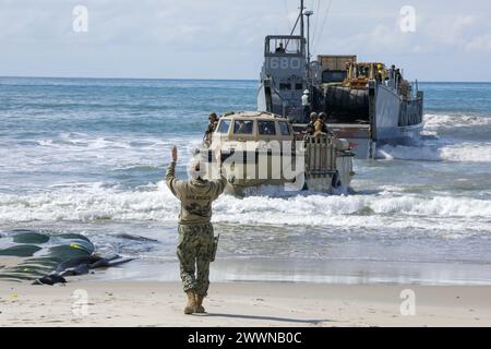 U.S. Navy Sailors assigned to Beachmaster Unit 1 and the Amphibious Construction Battalion use a submersible matting system during an experimentation event during Project Convergence - Capstone 4 at Camp Pendleton, Calif., Feb. 29, 2024. Submersible matting creates a stable roadway system across an area to bridge the gap between low and high tide on the shoreline.   PC-C4 is the largest, two-phase experiment to date and assess how technology can enhance cross-domain military operations and unified strategic approaches involving partners from various nations and joint services.  Army Stock Photo