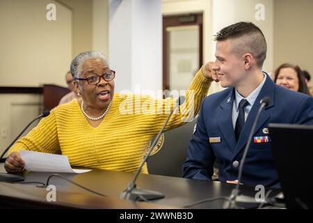 Retired Air Force colonel and State Rep. Pamela Stevenson, left, reads a summary of Senior Airman Ethan Hall’s accomplishments to the Kentucky General Assembly’s Interim Joint Committee on Veterans, Military Affairs and Public Protection during its regular meeting at the state Capitol in Frankfort, Ky., Feb. 13, 2024. Hall, a C-130J Super Hercules crew chief for the Kentucky Air National Guard’s 123rd Aircraft Maintenance Squadron, was recognized for exceptional performance.  Air National Guard Stock Photo