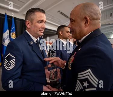 Master Sgt. Charles Wilding (left), the Kentucky Air National Guard’s 2023 Senior Non-Commissioned Officer of the year, receives the Kentucky Enlisted Exceptional Performance Award from Chief Master Sgt. Steven Best, 123rd Airlift Wing command chief master sergeant, during the Airman’s Gala at the Crowne Plaza Louisville Airport Exposition Center in Louisville, Ky., Feb. 10, 2024. The Gala celebrated the unit’s top-performing Airmen for 2023.  Air National Guard Stock Photo