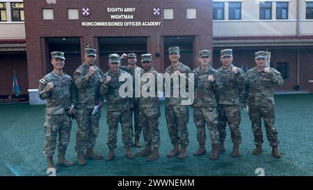 Sgt. Maj. of the Army Michael Weimer poses for a photo with cadre at the Wightman NCO Academy on Camp Humphreys, South Korea, Feb. 9, 2024.  Army Stock Photo