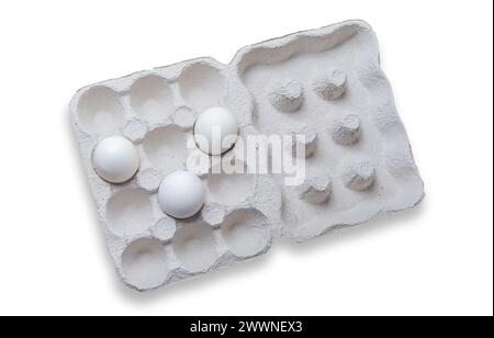 White eggs in a carton box on white background. Top view. Stock Photo