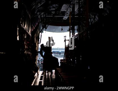 Airmen from the 435th Security Forces Squadron prepare to board a C-130J Super Hercules on Ramstein Air Base, Germany, on Feb. 13, 2024. The squadron is a part of the 435th Contingency Response Group which provides a scalable, cross-functional and rapidly deployable force designed to assess and open air bases and perform initial airfield operations, enabling rapid standup of combat operations anywhere in the U.S. European Command area of responsibility.  Air Force Stock Photo