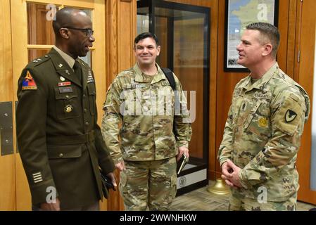 U.S. Army Maj. Gen. William 'Bill' Green Jr., chief of chaplains, talks with U.S. Army Garrison Fort Hamilton Command Sgt. Maj. Christopher Hill, and Chaplain (Maj.) Jonathan Bailey, garrison chaplain on Feb. 2, 2024, at garrison headquarters. During his visit, Green met with garrison leadership and presided over the promotion of Lt. Col. (Chaplain) James Fisher. Hamilton is the only active U.S. Army base in the New York City area, home to the New York City Recruiting Battalion, and New York Military Entrance Processing Station (MEPS), one of two largest MEPS in the nation.  Army Stock Photo