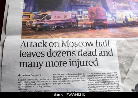 'Attack on Moscow hall leaves dozens dead and man more injured' Guardian newspaper headline terrorist attack shooting Russian 22 March 2024 London UK Stock Photo