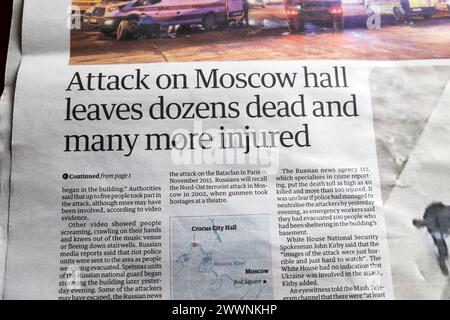 'Attack on Moscow hall leaves dozens dead and man more injured' Guardian newspaper headline terrorist attack shooting Russian 23 March 2024 London UK Stock Photo