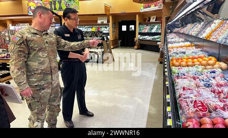 Sgt. Maj. of the Army Michael Weimer visits with staff at the Camp Walker Commissary in Daegu, South Korea, Feb. 10, 2024.  Army Stock Photo